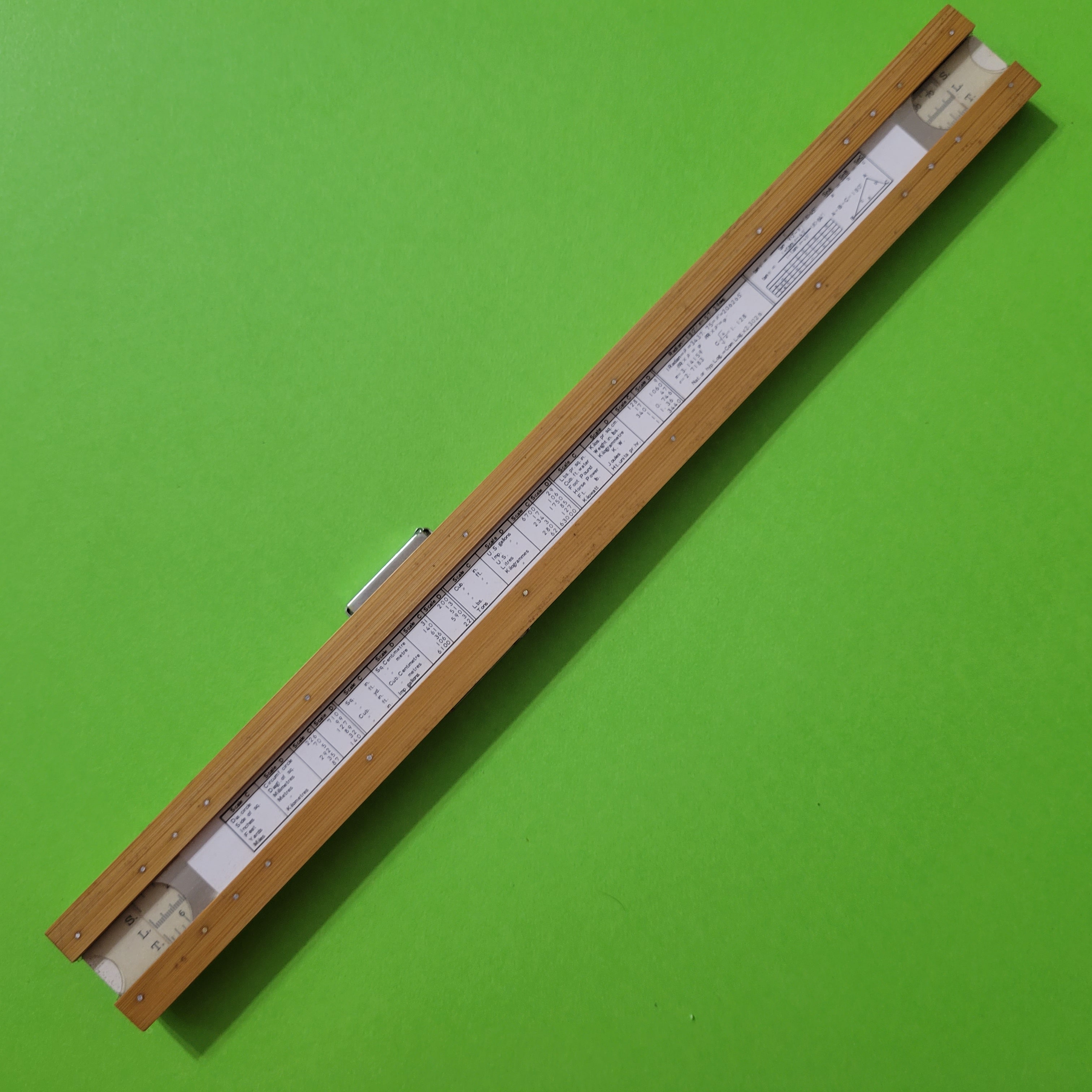 An image of the back of a Hughes-Owens Co.Limited (Sun Hemmi) No.1768C slide rule